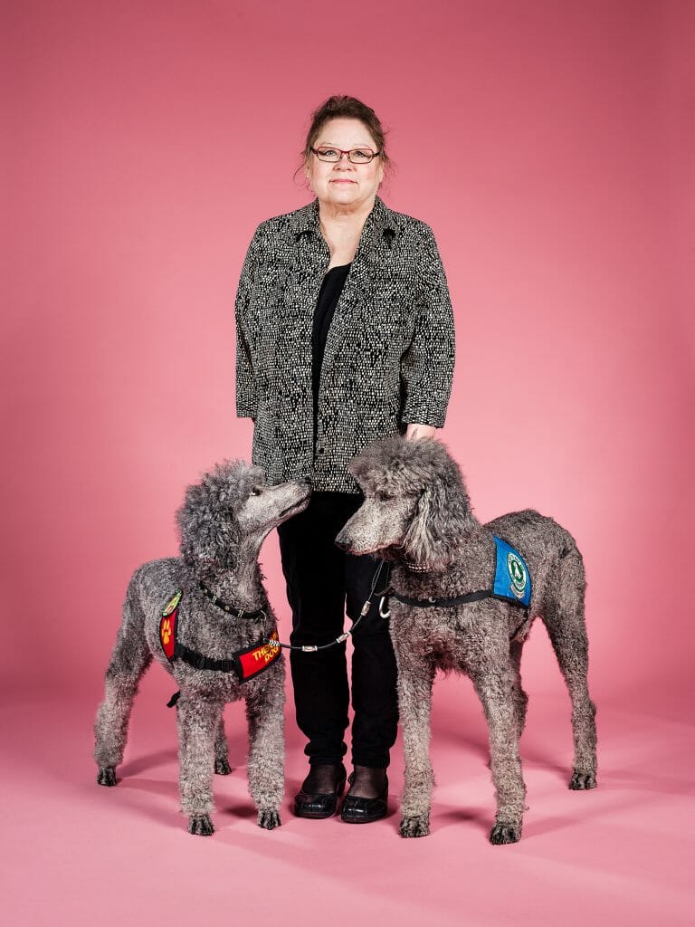 Poodle service dogs Titan and Jodie with owner Laura